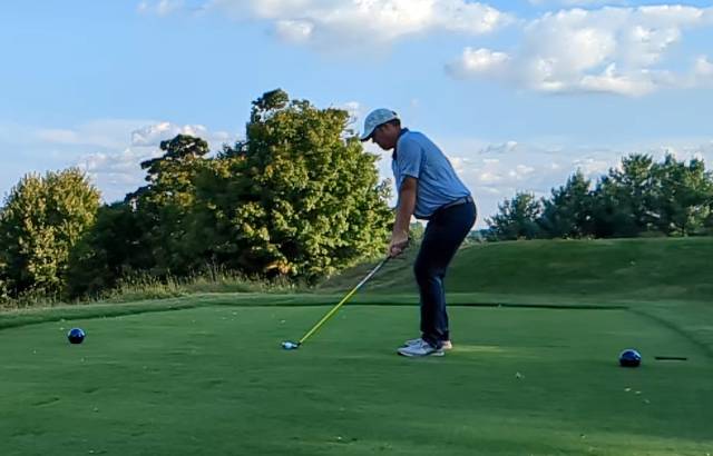 Golfer addressing the ball