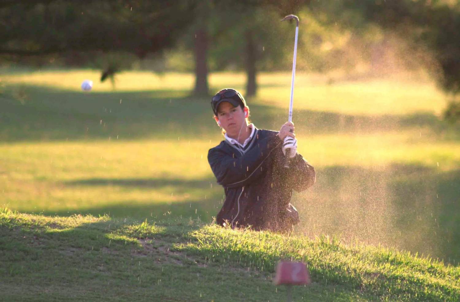 Golfer practicing short game shots