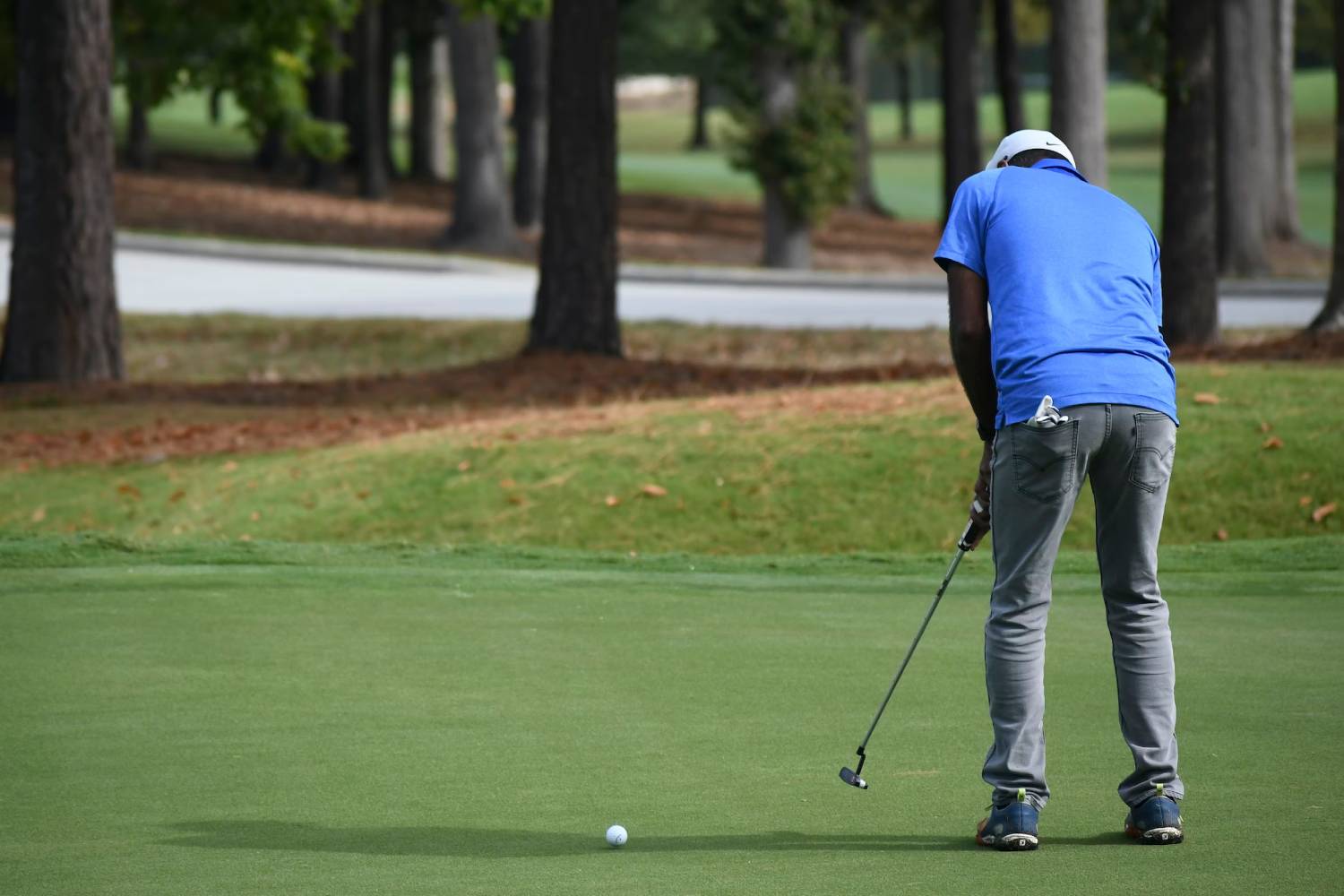 A golfer putting